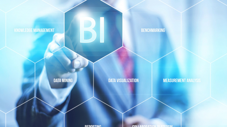 A person in a suit touches a glowing BI icon on a transparent hexagonal interface, surrounded by terms like knowledge management, benchmarking, data mining, data visualization, and measurement analysis.