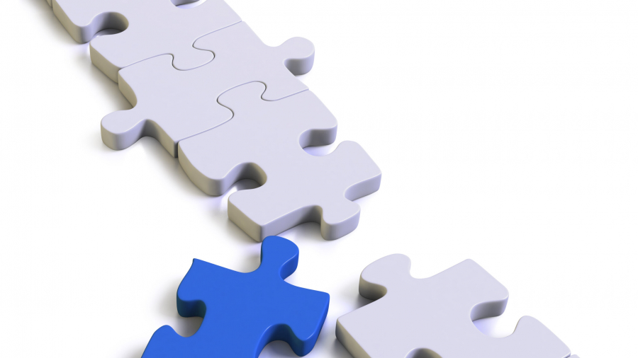 A row of white puzzle pieces with one missing piece. A single blue puzzle piece is positioned in front of the gap, ready to be placed into the empty spot.