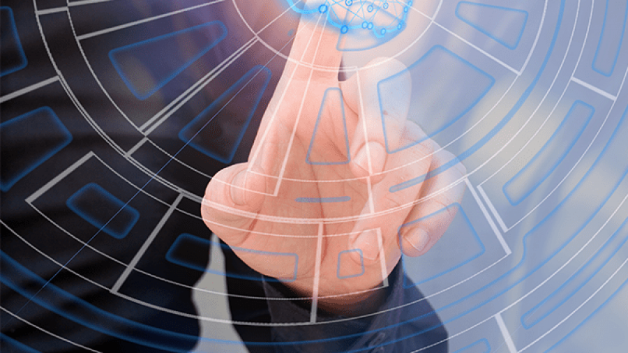 A person in a suit touches a virtual touchscreen displaying a glowing digital network and circular interface, symbolizing technology and innovation.