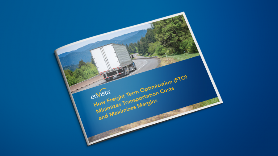 A booklet on a blue surface displays a cover image of a semi-truck driving on a highway through a scenic, wooded landscape. The title reads: How Freight Term Optimization (FTO) Minimizes Transportation Costs and Maximizes Margins.