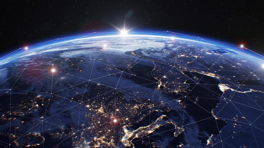 A view of Earth from space shows city lights, land, and water with a glowing sunrise on the horizon. Network lines and glowing nodes overlay the image, suggesting global connectivity.