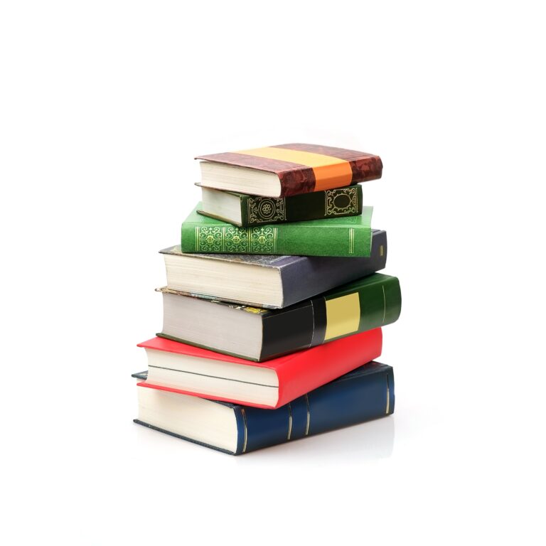 A stack of six hardcover books with different colored covers, including red, green, yellow, blue, and brown, arranged on a white background—perfect for adding a touch of distribution consulting style to any workspace.