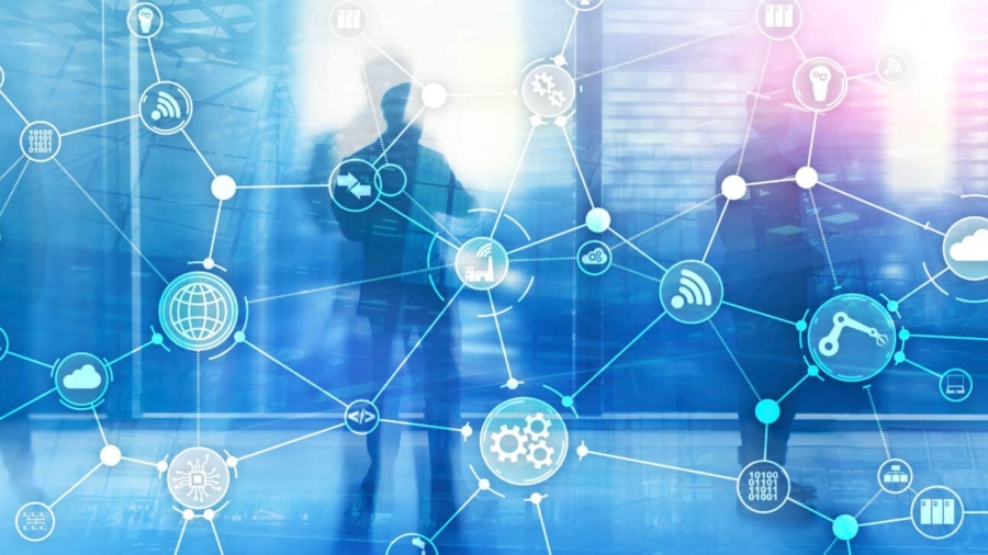 Abstract image of silhouetted people standing in a modern office, overlaid with interconnected digital network icons representing technology, supply chain execution software, and global connectivity. Blue tones dominate the background.