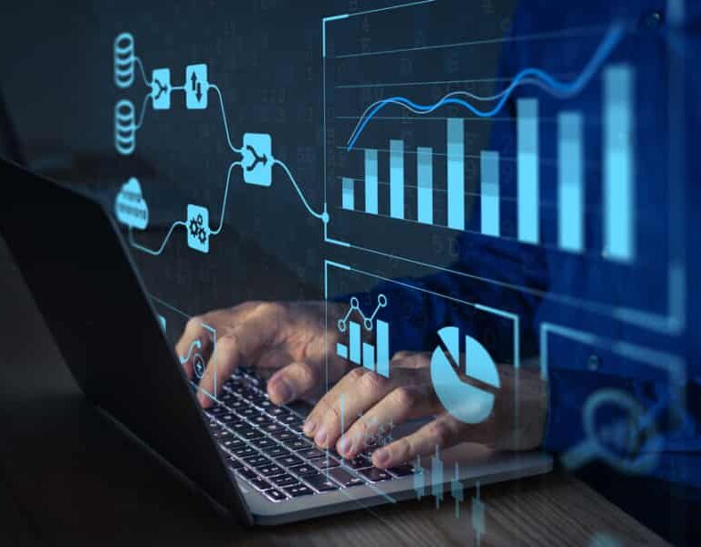 A person types on a laptop with digital graphics of charts, graphs, and data flow diagrams overlaid, representing data analysis or business analytics within an ERP system.