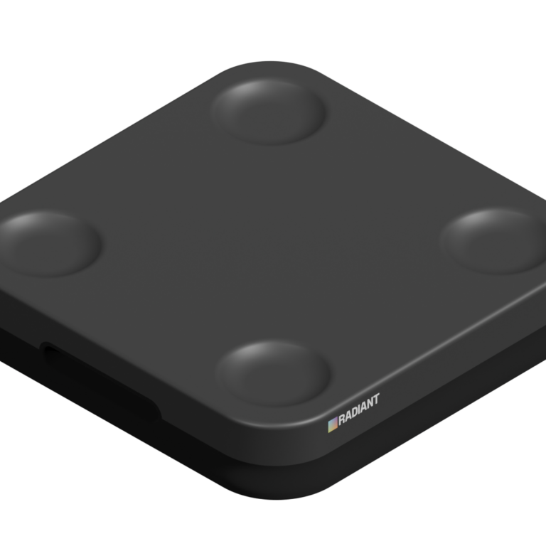 A black, square-shaped electronic device with rounded corners and four raised circular areas on top. The device features the RADIAnt logo and text on one side—ideal for use in a warehouse or Advantage Library setting. The background is white.