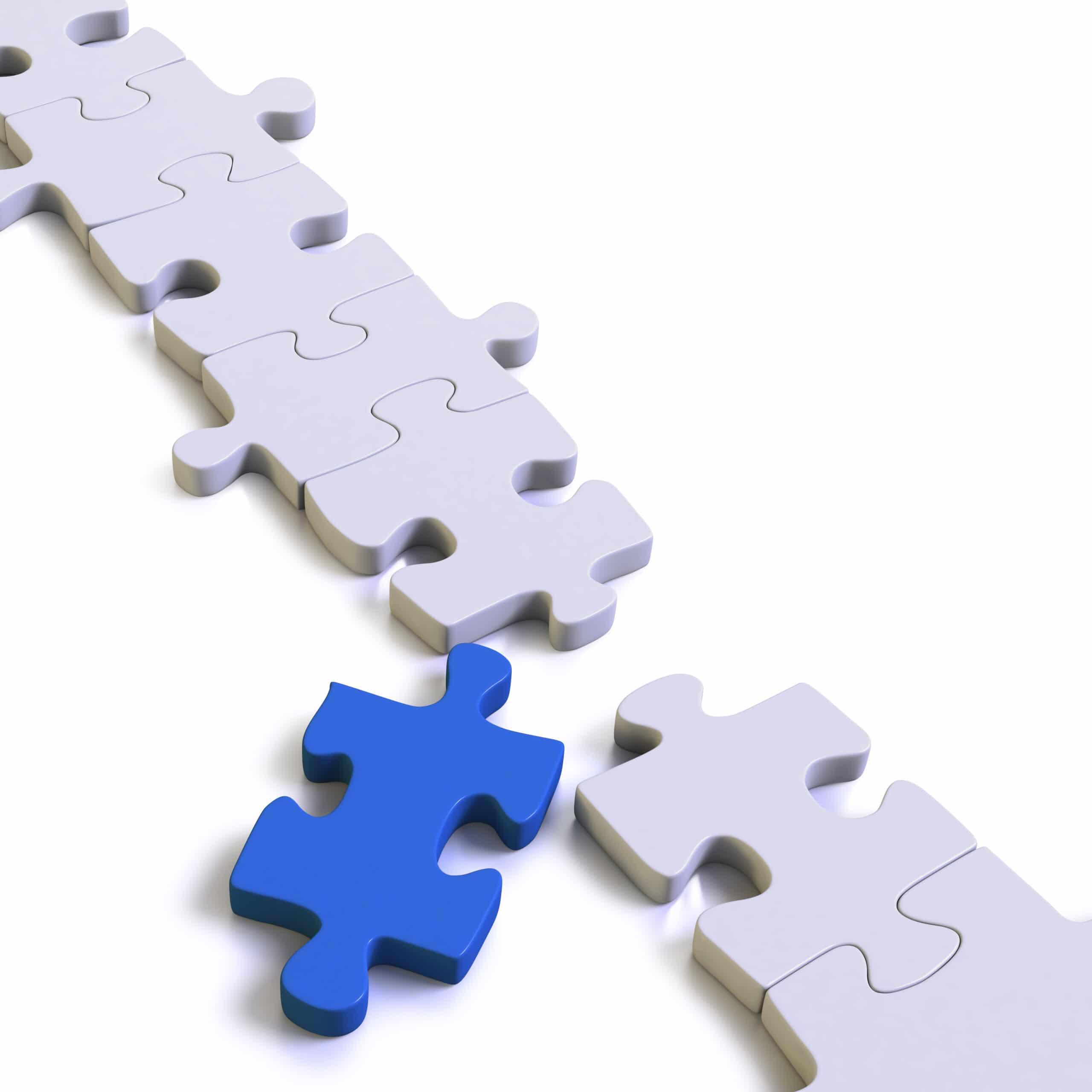 A nearly completed white puzzle with one missing piece, which is blue and placed near the empty spot, ready to be fitted in. The background is white, emphasizing the contrast between the blue and white pieces.