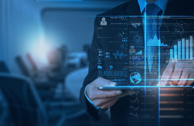 A man in a suit uses a tablet device, with futuristic digital data graphics and charts projected in front of him—highlighting the impact of Power BI consulting services. In the background, a blurred office setting with empty chairs is visible.
