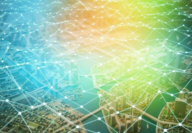 A digital illustration of a city landscape overlaid with a glowing network of interconnected lines and dots, symbolizing connectivity or smart city technology in the retail supply chain, set against a gradient blue to yellow background.