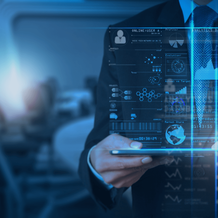 A person in a suit uses a tablet, with futuristic digital graphs, charts, and data projections overlaying the image, suggesting advanced technology and data analysis in a business setting.