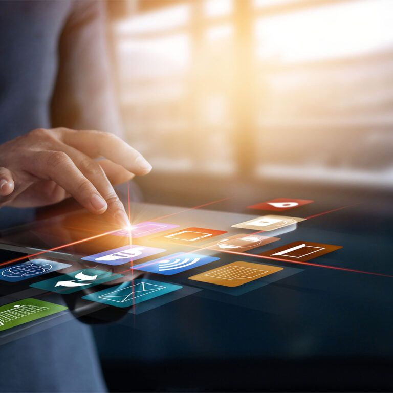 A person in a suit interacts with floating digital icons, representing various apps and technologies—visually exploring what is omnichannel fulfillment—against a blurred office background.