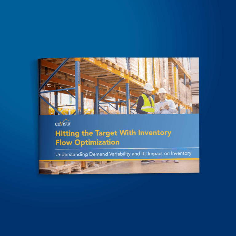 A warehouse scene with two workers in safety vests and helmets talking; shelves stocked with boxes in the background. The cover text reads: Hitting the Target With Inventory Flow Optimization.