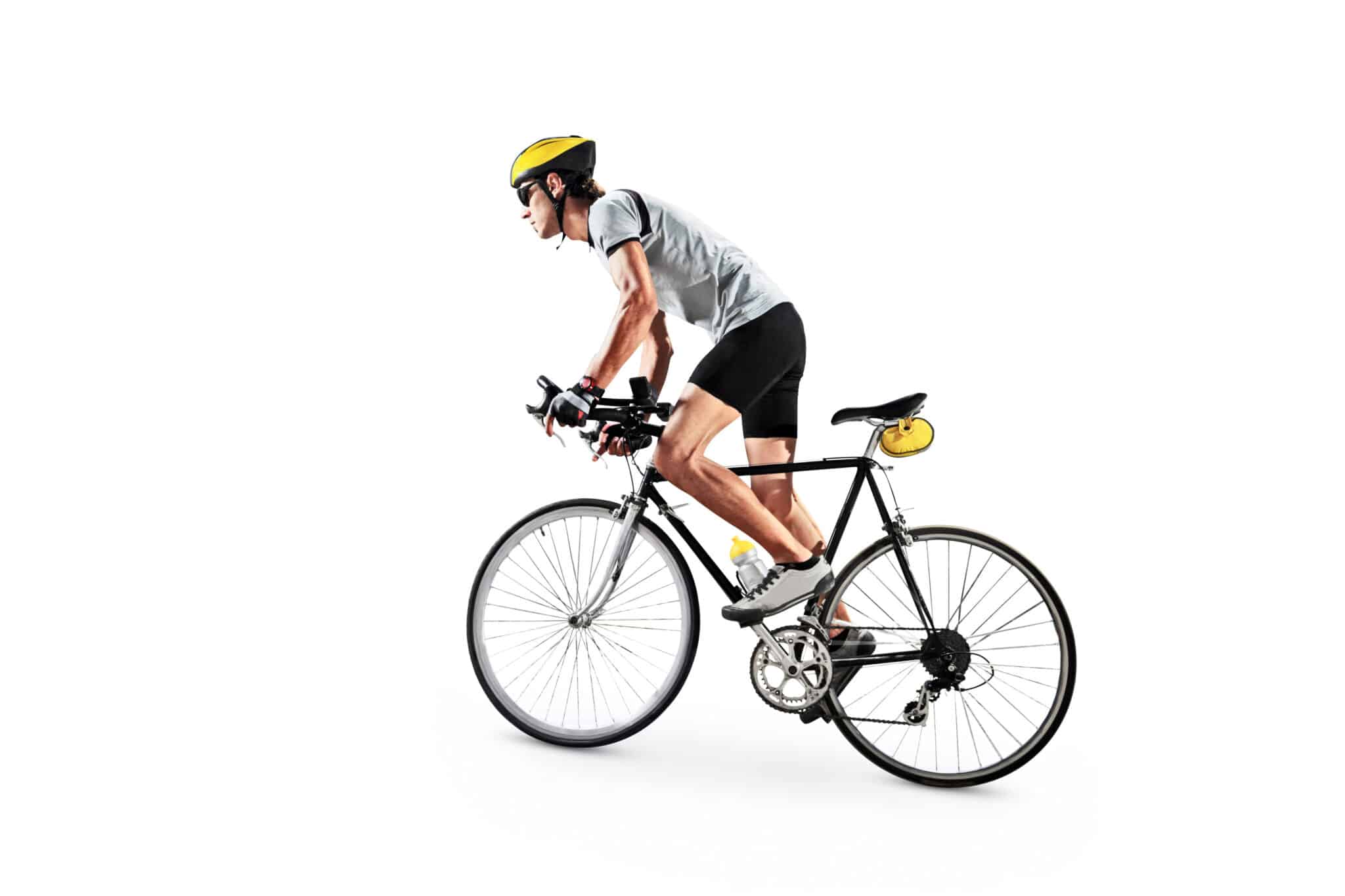 A cyclist wearing a yellow helmet, gray shirt, and black shorts rides a road bike with a water bottle and yellow saddlebag, isolated on a white background—ready for deliveries powered by Manhattan WMS efficiency.