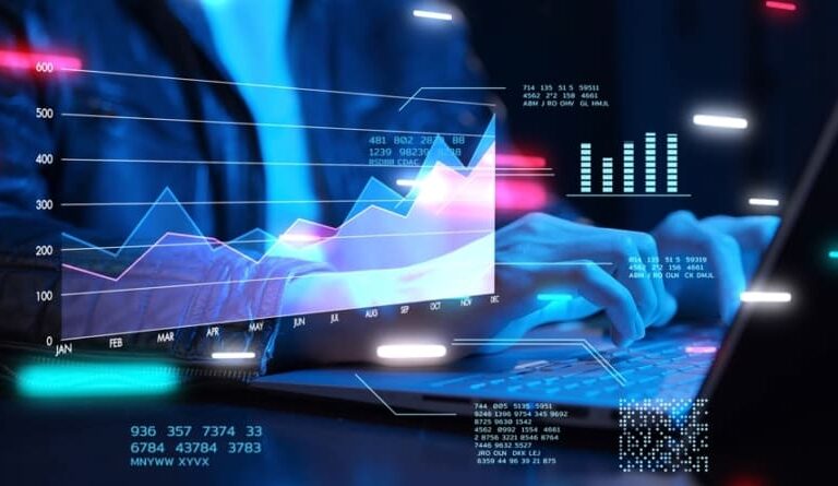 A person types on a laptop with digital graphs, charts, and data visualizations overlaid, suggesting data analysis, financial trends, or business analytics in a modern, technology-driven environment.