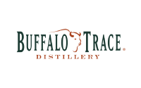 Buffalo Trace Distillery logo with dark green text and the outline of a buffalo’s head in orange above the word Trace. The word Distillery appears below in orange capital letters.