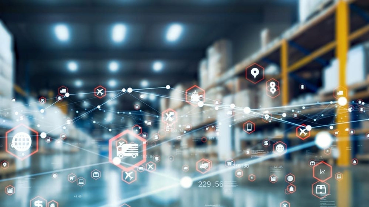 A warehouse with shelves full of boxes and digital network icons overlaying the image, representing logistics, supply chain, and connectivity in a modern, technology-driven environment.
