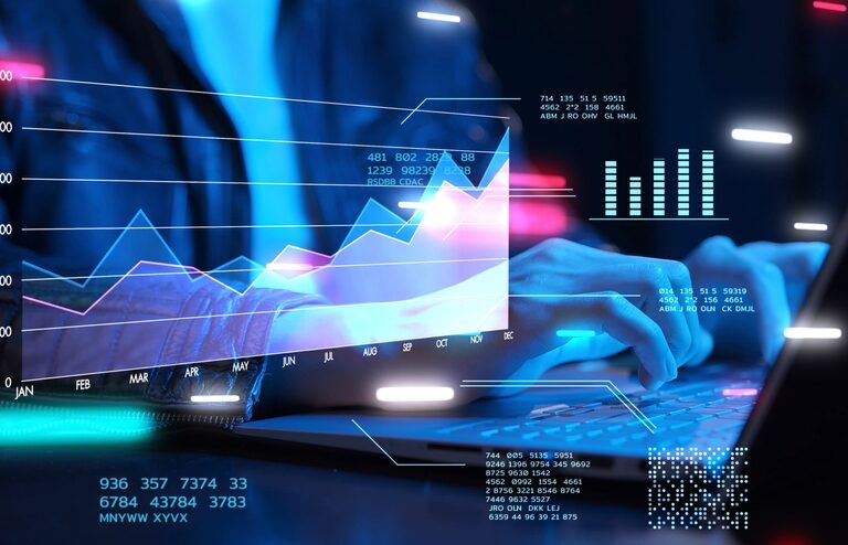 Person typing on a laptop with virtual graphs, charts, and data visualizations overlaid, symbolizing the dynamics of data analysis, business growth, or financial technology concepts. Neon colors and glowing effects highlight a modern, tech-focused scene.