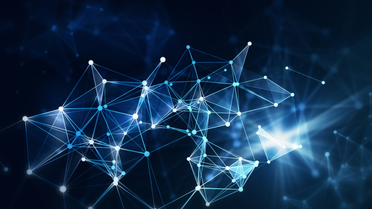 Abstract image of interconnected lines and glowing nodes forming a network on a dark blue background, visually symbolizing technology, data flow, or the complexity of developing an effective supply chain strategy.